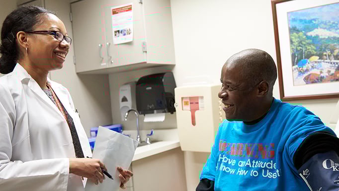 Grace_Berry__MD__CCP__with_a_patient