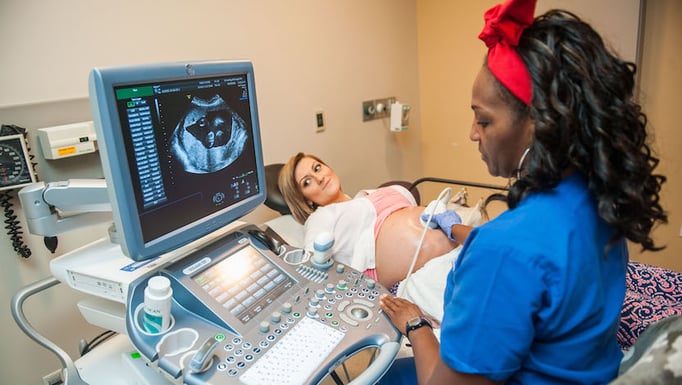 Pregnant woman receiving ultrasound