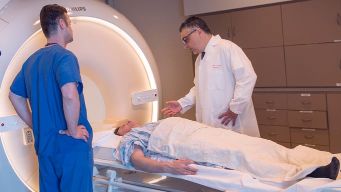 Aytekin Oto with a patient in the MRI machine