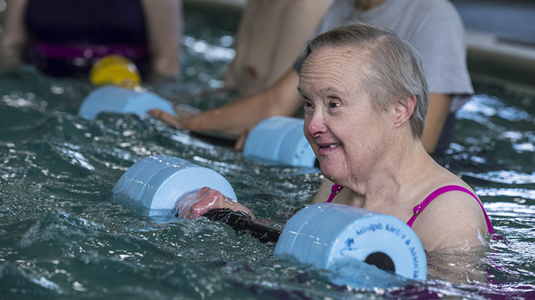 Image of a Misericordia resident swimming and doing water aerobics