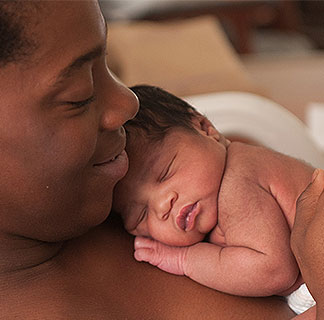 Mother and newborn baby skin to skin in the Family Birth Center