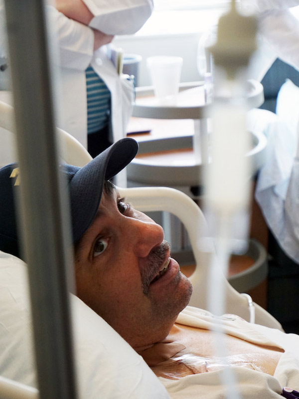 Scott McIntyre watches the CAR-T cell infusion