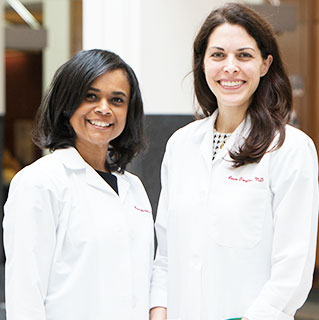 Portrait of gynecologists Monica Christmas, MD, and Laura Douglass, MD