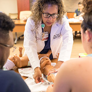 Prenatal nurse educator Evelyn Turner teaches an infant care class