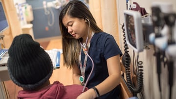 A nurse with the first patient served at the new UChicago Medicine emergency department