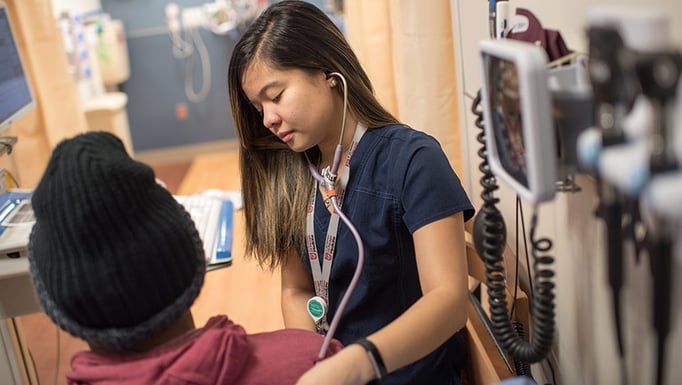 A nurse with the first patient served at the new UChicago Medicine emergency department