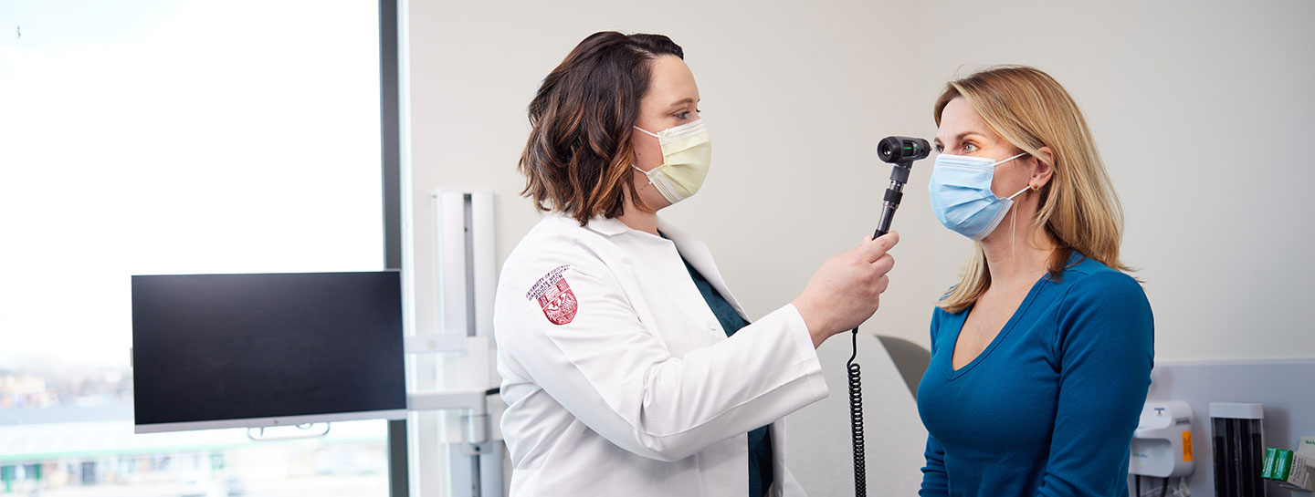 Dr. Cipriani evaluating a female patient