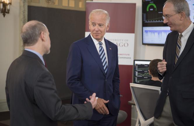 Vice President Joe Biden talks with Prof. Robert Grossman, MD, Department of Medicine and the College and Senior Fellow with the Computation Institute, and Louis M. Staudt, MD, PhD, right, with the NCI, as they tour the NCI Genomic Data Commons (GDC), a system designed and developed by the Center for Data Intensive Science at the University of Chicago and presented Monday, June 6, 2016, at their office in the Shoreland in Chicago. (Photo by Robert Kozloff)