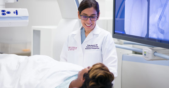 Uzma Siddiqui, MD, in interventional endoscopy lab with patient