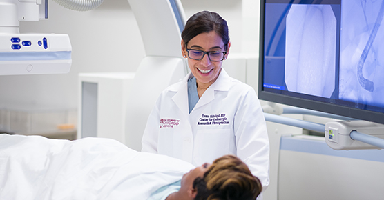 Dr. Uzma Siddiqui with patient Morris