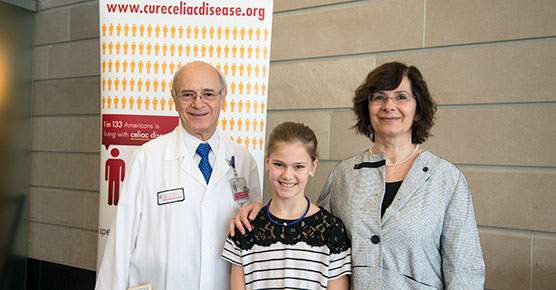 Stefano Guandalini (MD), patient Sofia Rocca, and Bana Jabri (MD, PhD) pose for a photo together at the Celiac Disease Center