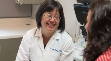 Dr. Nicole Leong consults with a patient