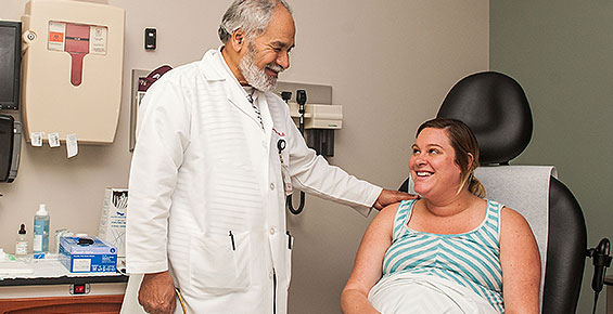 Dr. Mahmoud Ismail consults with a patient during her prenatal appointment