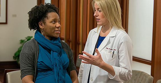 Dr. Abbe Kordik consults with a patient