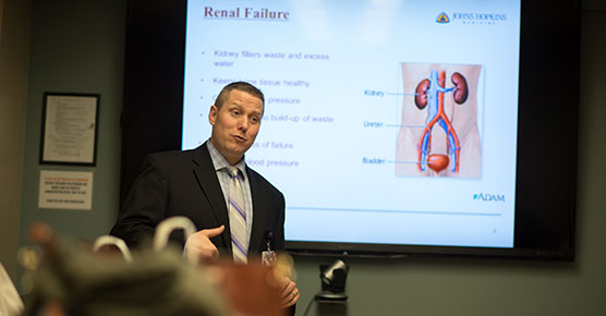 Staff member presenting during living kidney donor champion program meeting