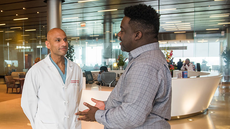 Mustafa Hussain, MD with a patient in the CCD
