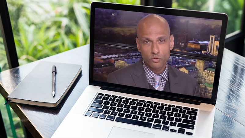 surgeon Mustafa Husain, MD, giving a telemedicine visit