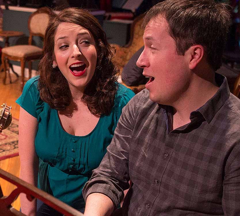 Actress Dara Cameron sings with husband and actor Michael Mahler during a dress rehearsal