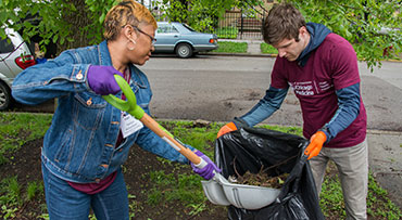 Two UChicago Medicine Day of Service and Reflection (DOSAR) volunteers performing gardening tasks