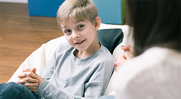 Child speaking with therapist