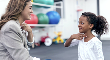 Child working with speech therapist