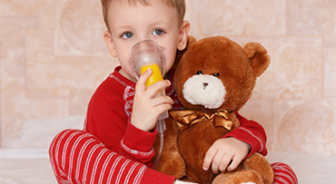 Boy with oxygen mask