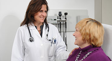 Endocrincologist, Silvia Pannain, speaks with a patient during an appointment