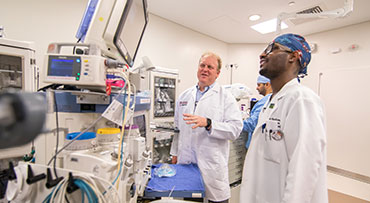 Dr. Kyle Hogarth with his team in surgery