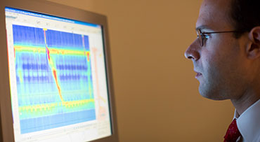 Dr. Robert Kavitt reading results of esophageal diseases diagnostic technology on a computer