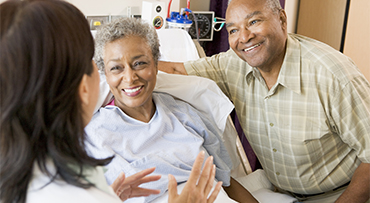 older couple in hospital bed