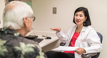 Hepatologist Helen Te, MD, with a liver patient