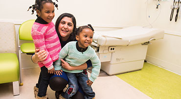 Dr. Peddinti with patients at La Rabida