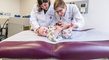 Drs. Stein and Rosenblatt examining patient