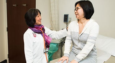 Dr. Yolanda Becker with a patient in DCAM
