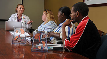 Kidney patient education session, with one nurse and three patients.