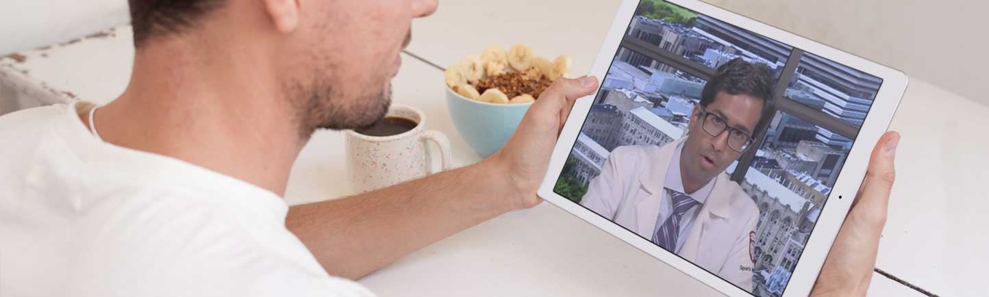 Aravind Athiviraham, MD, giving video visit