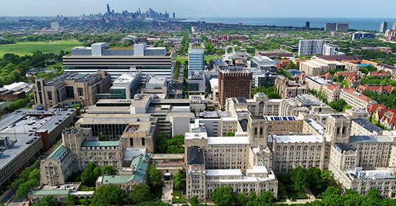 An aerial view of UChicago Medicine's main campus with the Chicago skyline in the background.