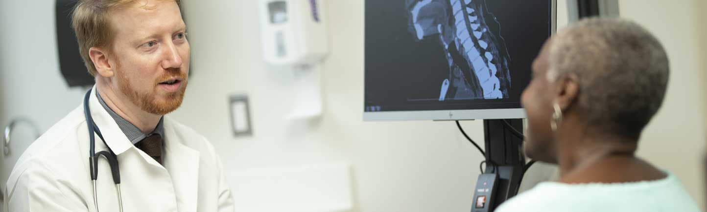 Medical oncologist Alexander Pearson, MD, and female patient