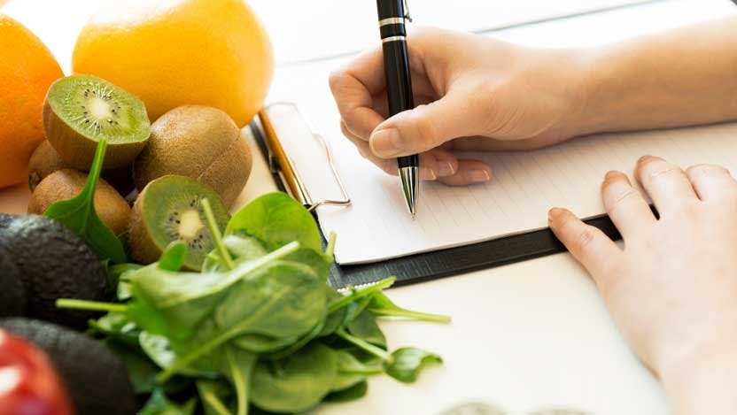 fresh food and person taking notes