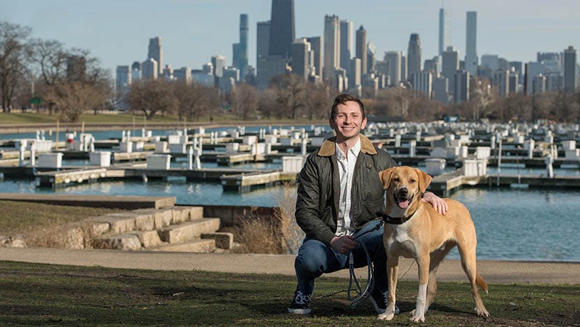 Barry Rapport with his dog and the Chicago skyline in the background. A UChicago Medicine clinical trial allowed him to avoid bleomycin, a lymphoma drug that can be harsh on the lungs. He's been cancer-free for two years.  