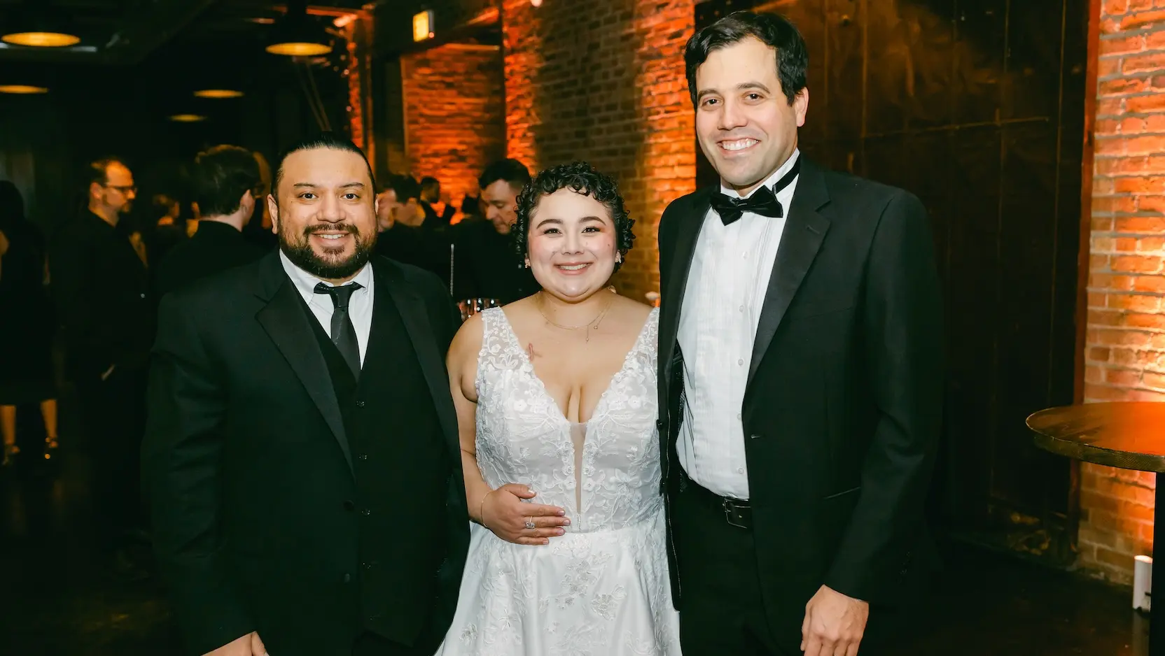 Mara Aguirre, her husband, Ever Hernandez, and UChicago Medicine oncologist Austin Wesevich, MD, MPH, MS, pose during the Wish Upon a Wedding gala where Wesevich received a Shining Star Award for his outstanding cancer care.