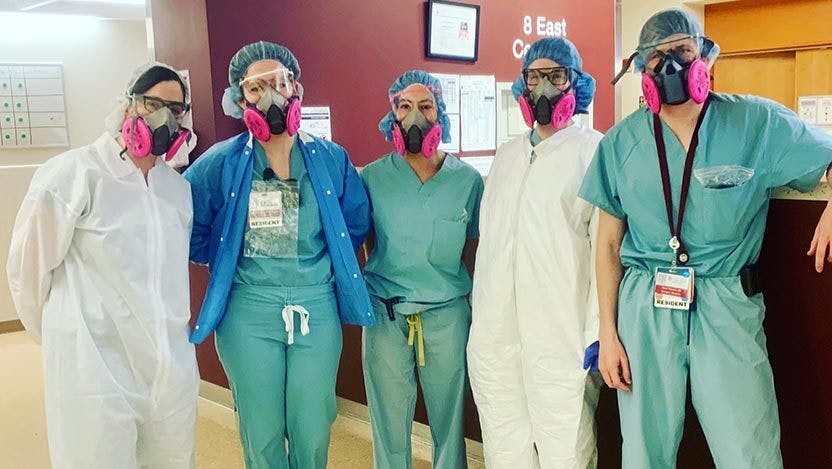 Valerie Press, MD, MPH, Associate Professor of Medicine and residents Alexandra Rojek, MD, Jori Sheade, MD, Albina Tyker, MD, and Kevin Prescott, MD pose for a photo in personal protective equipment.