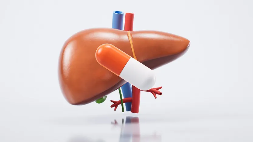 illustration of a pill in front of a human liver