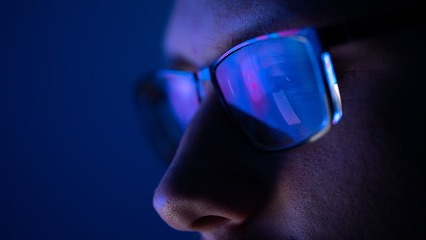 A man wearing light blocking glasses 