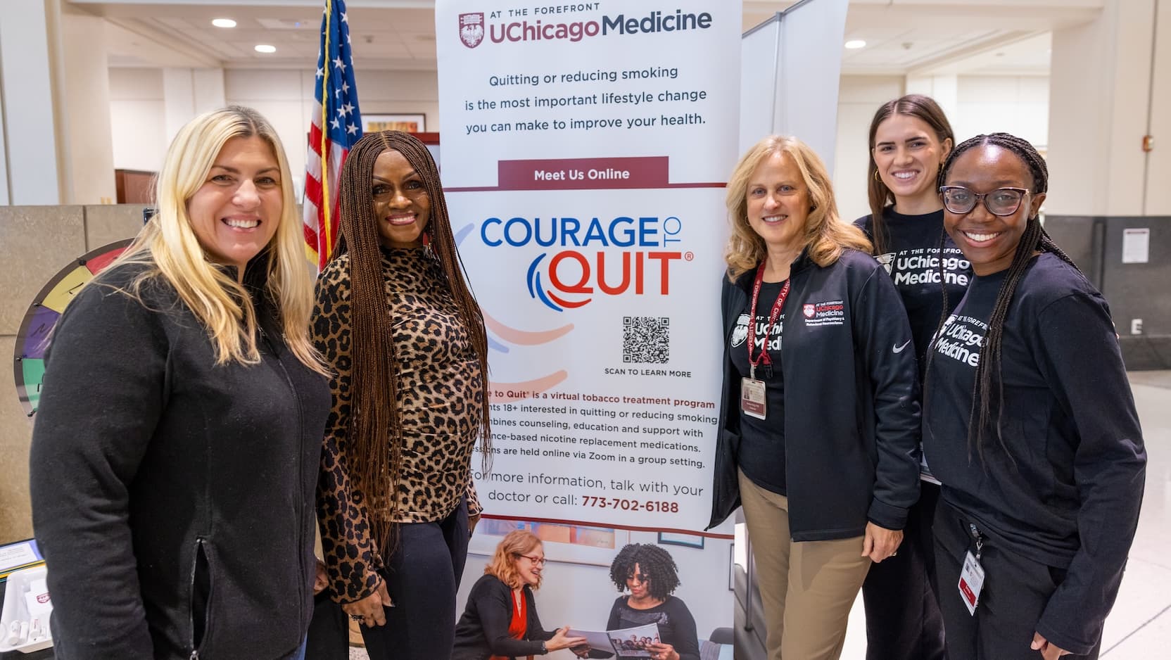 Courage to Quit team standing in front of UCM banner