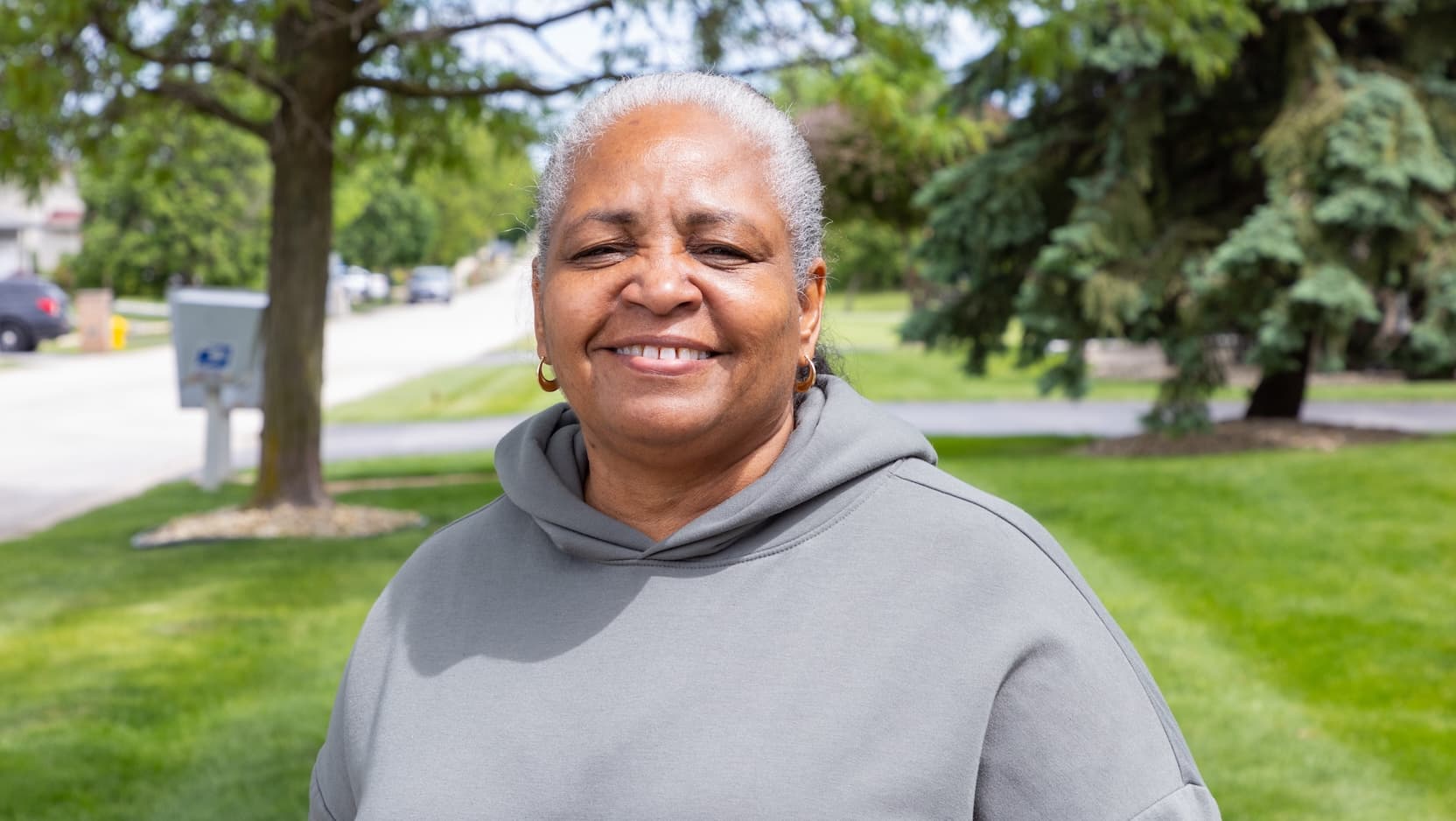 Sonya Alexander smiles comfortably after finding relief from joint pain through a clinical trial following breast cancer treatment.