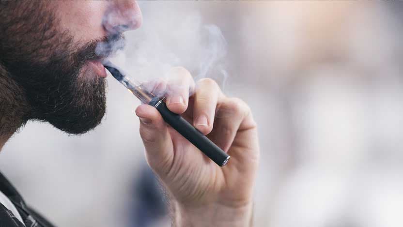 Man using vaping pipe