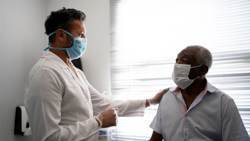 stock doctor and patient with masks on