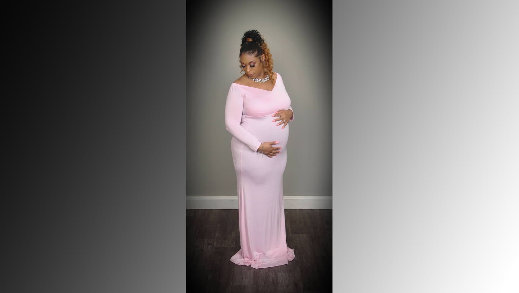Porscha Lacey-Johnson poses in a pink gown, elegantly cradling her pregnancy belly