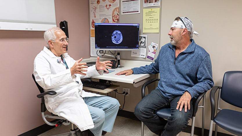 Peter Warnke, MD, with patient Donald Schwartz.
